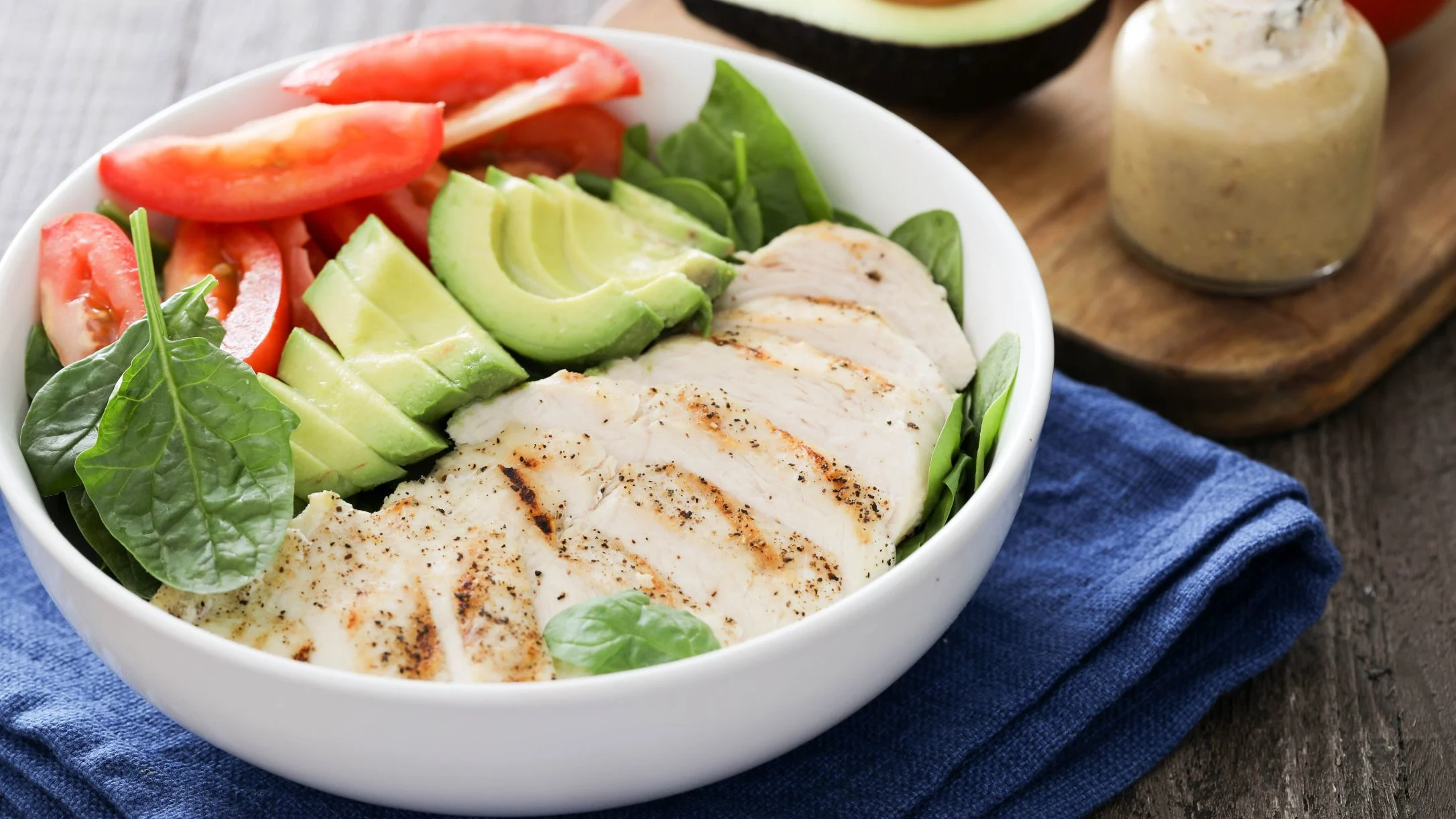 grilled-chicken-over-baby-spinach-tomato-and-avocado-salad 1
